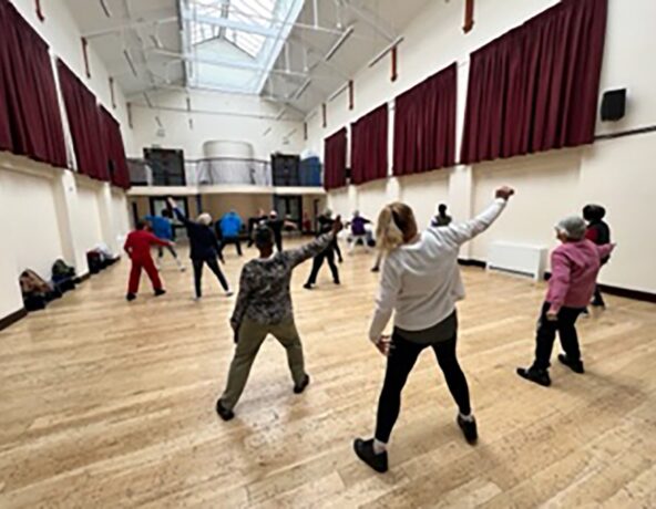 Group dancing in community centre