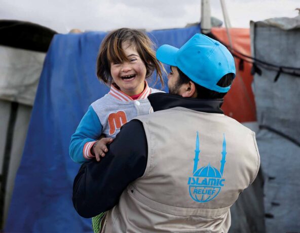 Worker helps small child