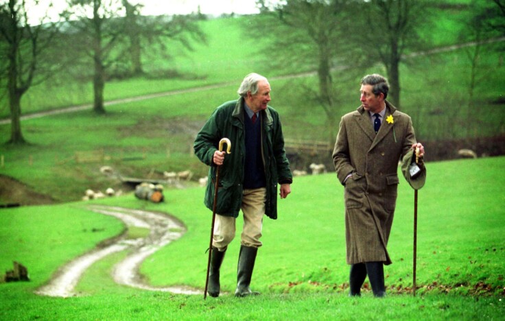 King Charles out walking in the countryside with a friend in the 19980s