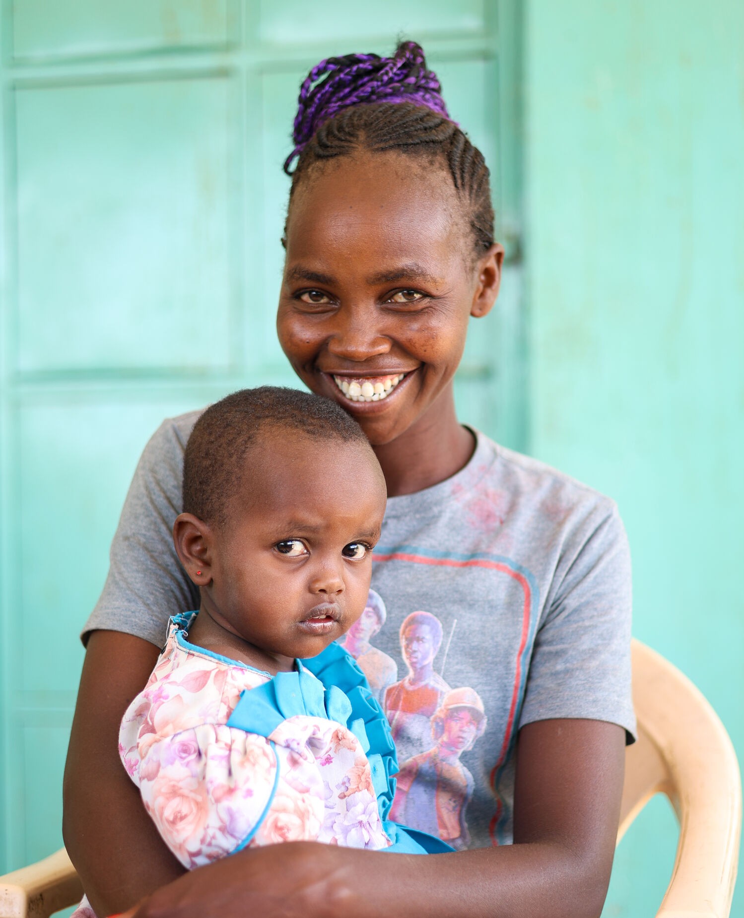 Woman holding a young child.